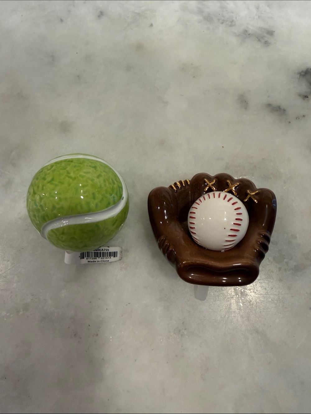 Nora Fleming “Game, set, match”tennis ball and “Catch some fun!” baseball mit